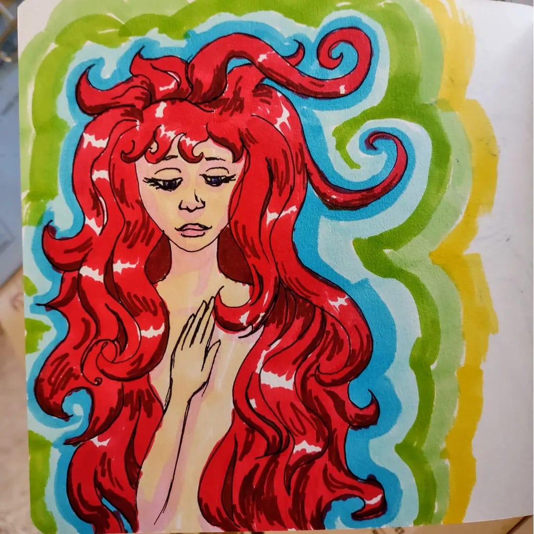 A sketchbook open to a drawing in brightly colored markers of a person surrounded by waves of cherry-red hair.